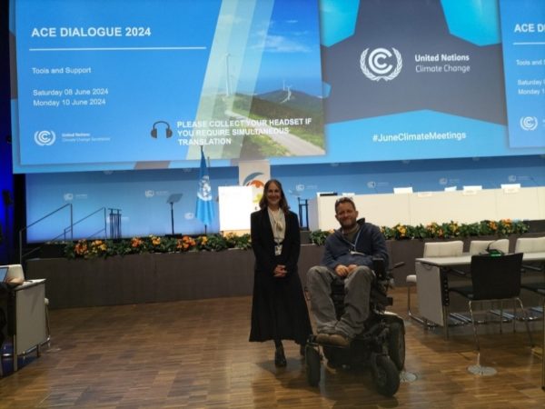 Giulia Traversi and Gordon Rattray pose together in the conference hall